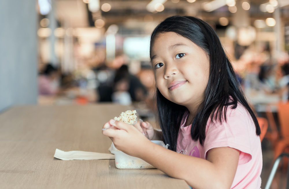 Asian girl posing with food
