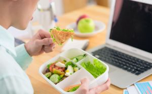 Office Mistakes in Lunch Box Composing Man Eating from Lunch Box in Office